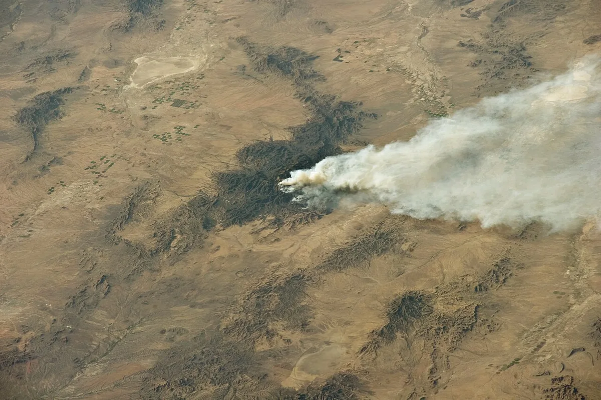 Horseshoe 2 Fire (2011) in Cochise County, Arizona - This astronaut photograph illustrates the area (approximately 8,900 hectares, or 22,110 acres) and position of the Horseshoe 2 fir