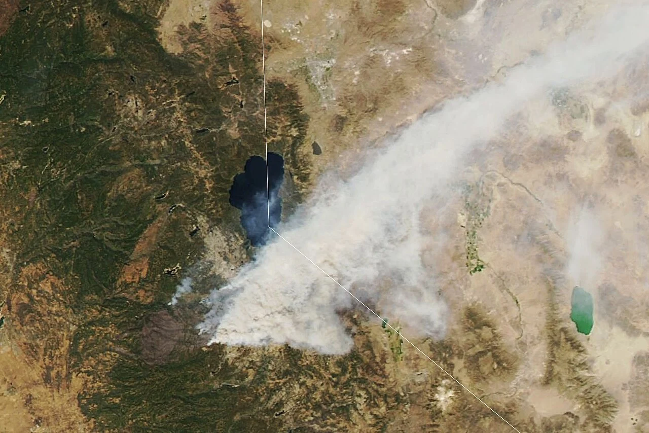NASA MODIS satellite image from August 2021 showing the Caldor Fire smoke plume streaming northeast across Lake Tahoe and into Nevada