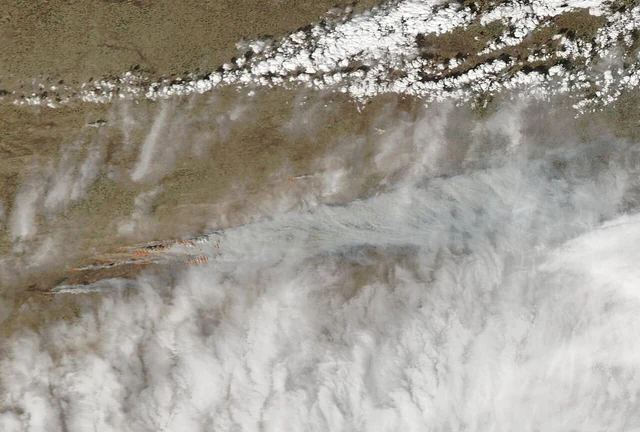 MODIS satellite image showing the vast dark burn scar left across the Texas Panhandle by the Smokehouse Creek Fire in early March 2024