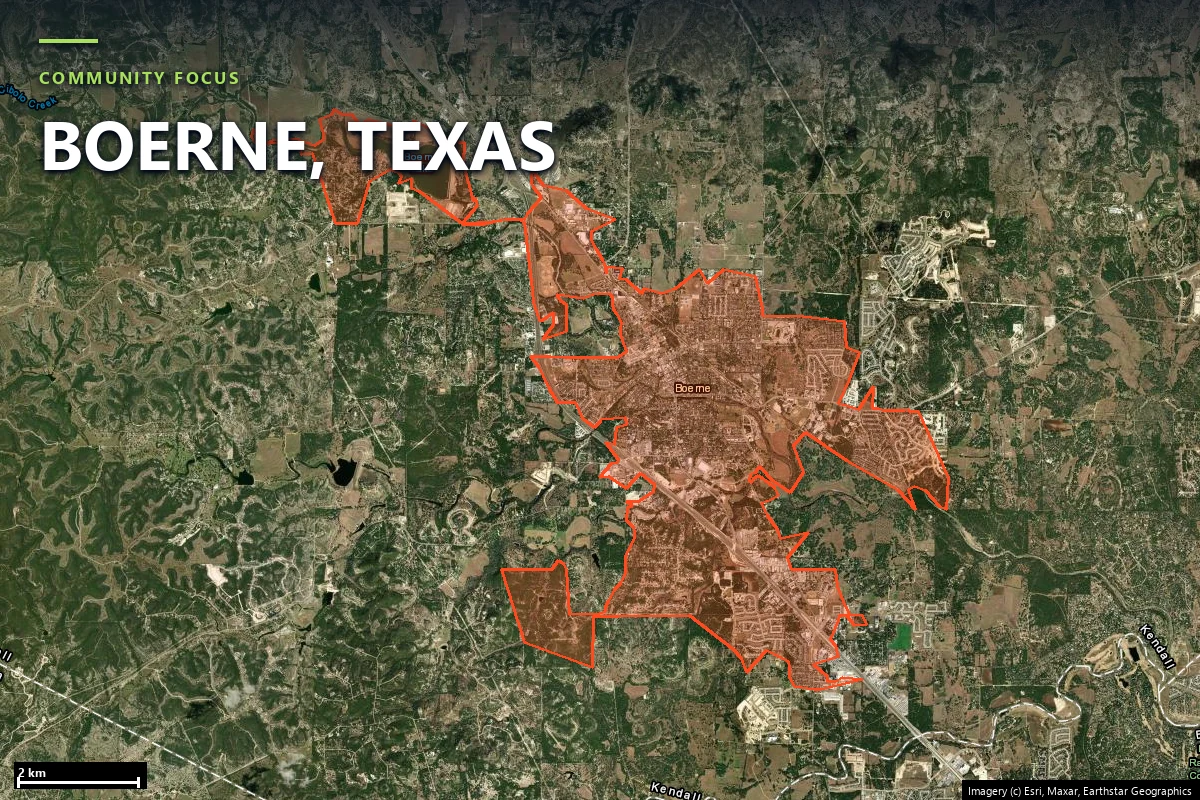 Satellite close-up of the Boerne-area case-study community in Kendall County, showing houses dispersed through tree cover and winding Hill Country roads
