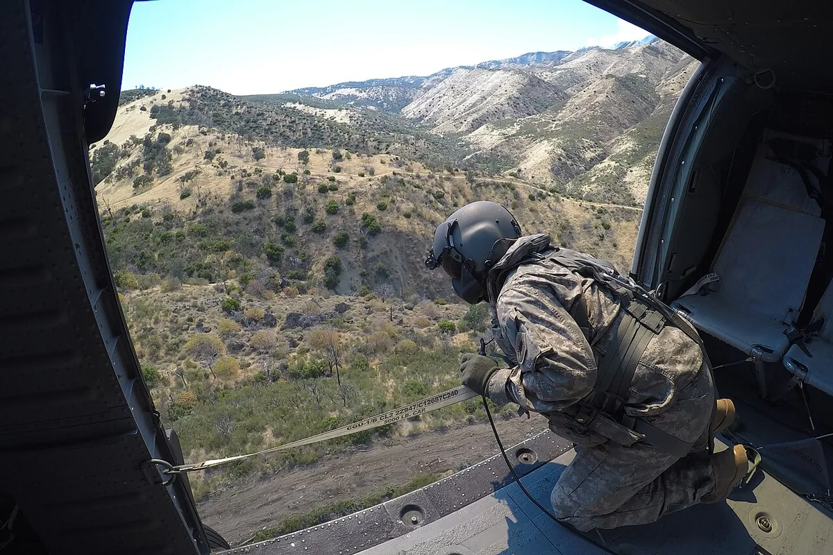 Garza Fire (2017) in Kings County, California - Staff Sgt. Ge Xiong, crew chief aboard a UH-60 Black Hawk from the 1106th Theater Aviation Sustainment Maintenance Group (TASMG), 
