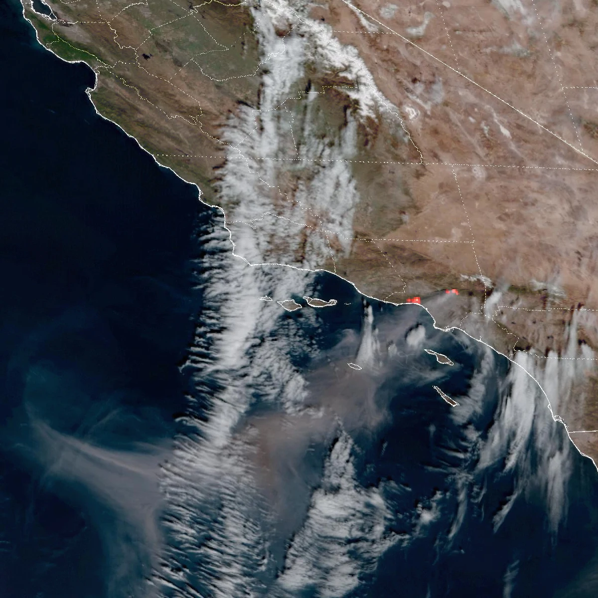 GOES-18 satellite image from January 8, 2025 showing the Palisades and Eaton fires burning simultaneously along the Southern California coast, with red fire-temperature hotspots and smoke streaming offshore