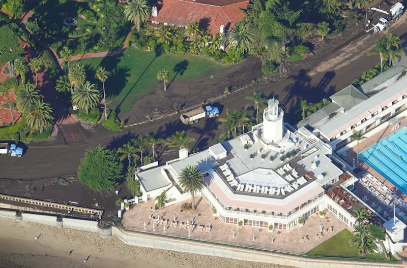 Aerial photo taken January 11, 2018 of the Montecito debris flow at Butterfly Beach, with mud from the Thomas Fire burn scar covering the coastal road past the Coral Casino and reaching the ocean
